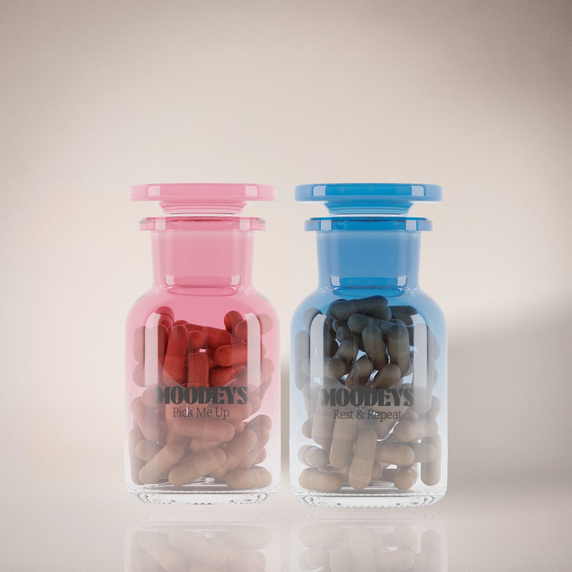 Two glass jars, one pink and one blue, filled with rest and repeat and pick me up on a light background.