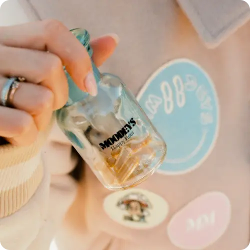 Mood Boosting Supplement Bottle in hand