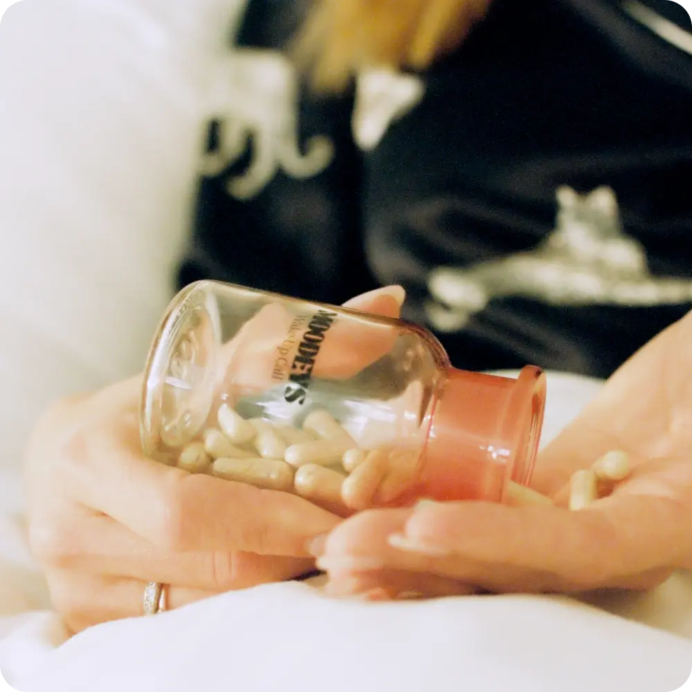 Wake-Up Call bottle shaking into hand
